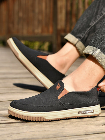 CANEMON LY553 black canvas slip-on shoes close-up on-foot view
