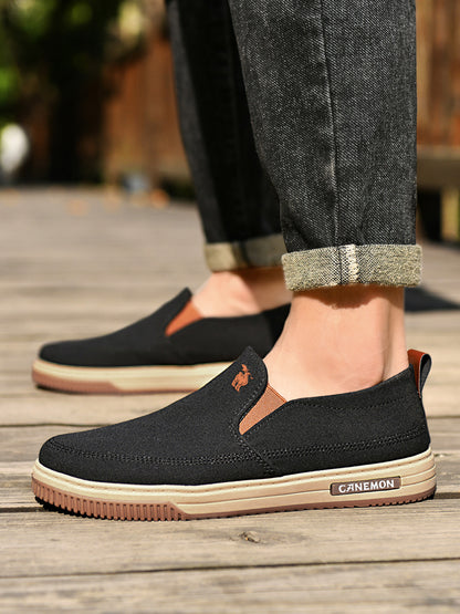 CANEMON LY553 black canvas slip-on shoes worn with casual trousers