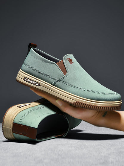 CANEMON LY553 mint green canvas slip-on shoes supplier photograph of the shoe flexing by hand