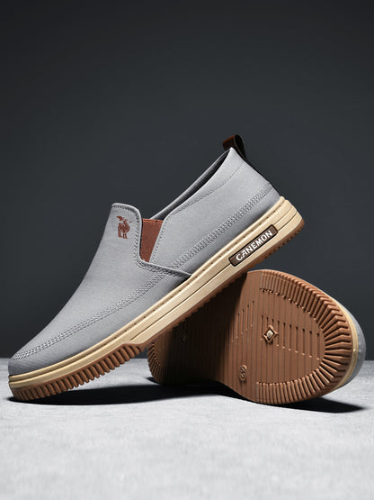 CANEMON LY553 grey canvas slip-on shoes showing the PVC outsole