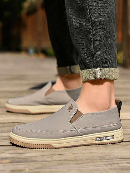 CANEMON LY553 khaki canvas slip-on shoes worn with casual trousers